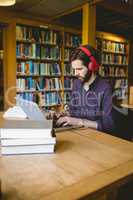 Hipster student studying in library