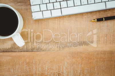 Business desk with coffee and keyboard