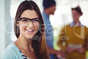 Young creative worker smiling at camera