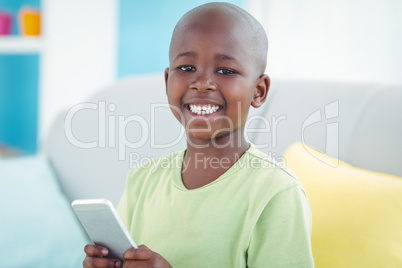 Happy boy using a smartphone