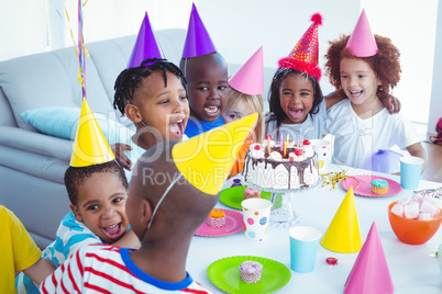 Excited kids enjoying a birthday party