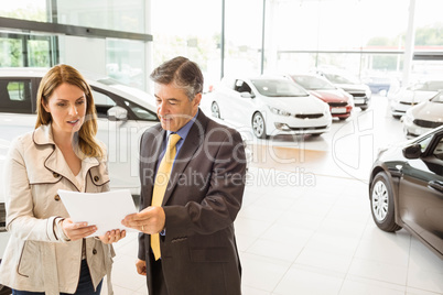 Salesman explaining the contract to a client