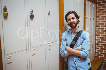 Hipster student smiling at camera in hallway