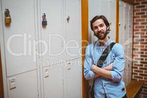 Hipster student smiling at camera in hallway