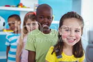 Happy kids standing in a line