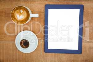 Above view of coffee and a blue tablet