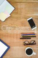 Business desk with smartphone and colors pencil