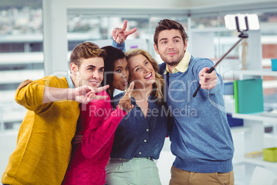 Smiling creative team posing for a selfie