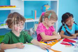 Happy kids all drawing pictures