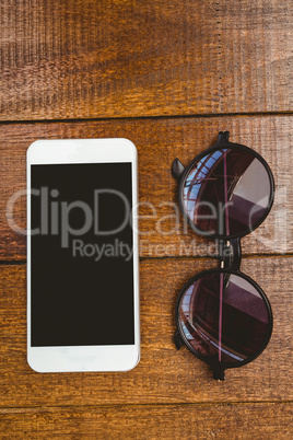 View of glasses and a smartphone