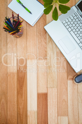 Business desk with laptop and colors pencil