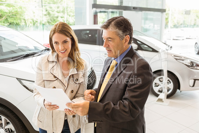 Salesman explaining the contract to a client