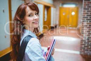 Mature student opening her locker