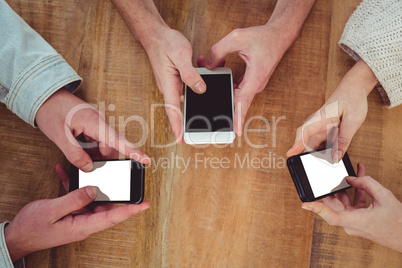 Creative team all using smartphones