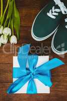 View of sneakers and blue gift