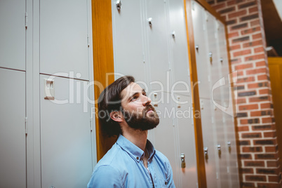 Hipster student feeling sad in hallway