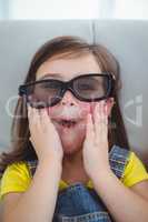 Close up of a girl wearing 3d glasses for a moive