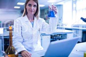 Scientist working with a laptop in laboratory