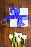 View of white flowers and blue gifts