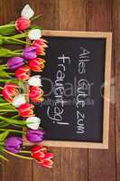 Bouquet of colored flowers against black board