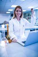 Scientist working with a laptop in laboratory