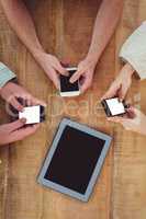 Creative team all using smartphones