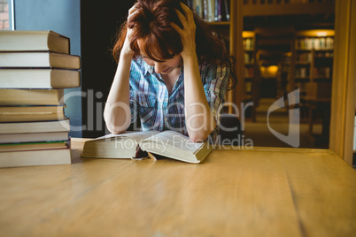 Mature student studying in library