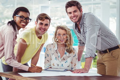 Creative business team working on a tablet together