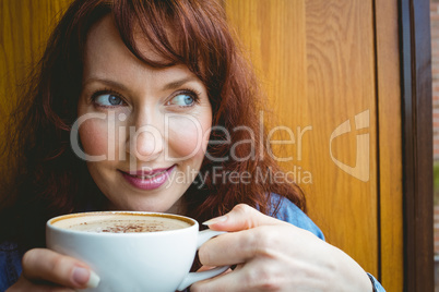 Mature student having coffee in cafe