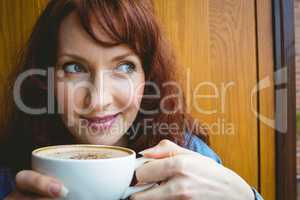 Mature student having coffee in cafe