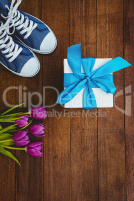 View of sneakers and blue gift