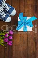 View of sneakers and blue gift