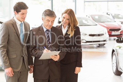 Group of smiling business team standing together