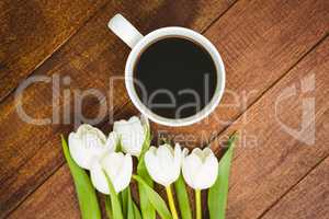 White flowers and a cup of coffee