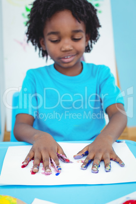 Happy kid enjoying arts and crafts painting