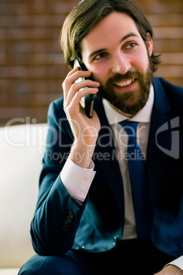 Businessman talking on the couch