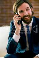 Businessman talking on the couch