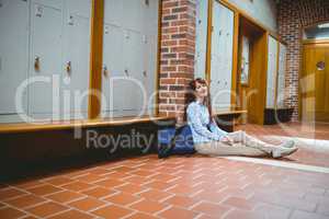 Mature student smiling at camera in hallway