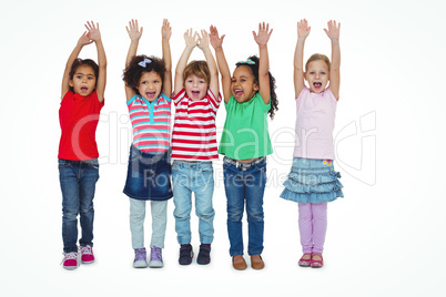 Small group of kids standing together with arms raised