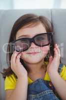 Close up of a girl wearing 3d glasses for a moive