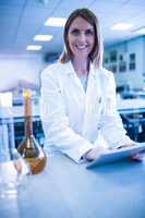 Scientist working with a tablet in laboratory