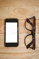 View of glasses and a smartphone