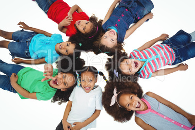 Small group of girls lying down looking upwards