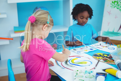 Happy kids enjoying arts and crafts painting