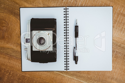 View of an old camera and a notebook