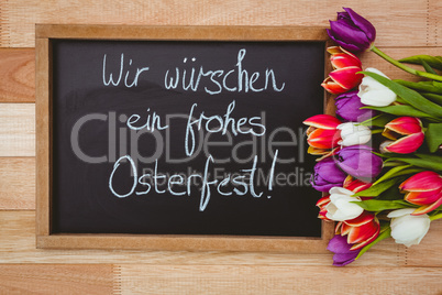 Bouquet of colored flowers against black board