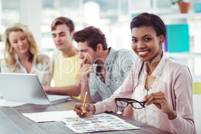 Creative business team working on a laptop together