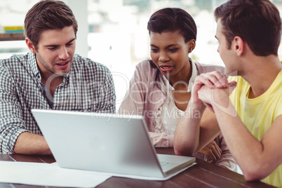 Creative team working together on a laptop