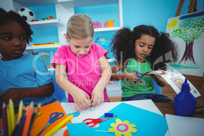 Happy kids doing arts and crafts together