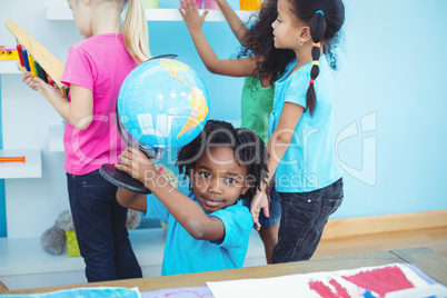 Small group of kids in playing with toys